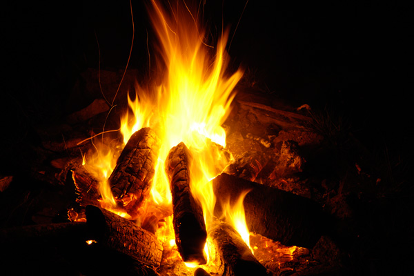 A campfire burning at night